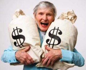 Smiling woman with money bags
